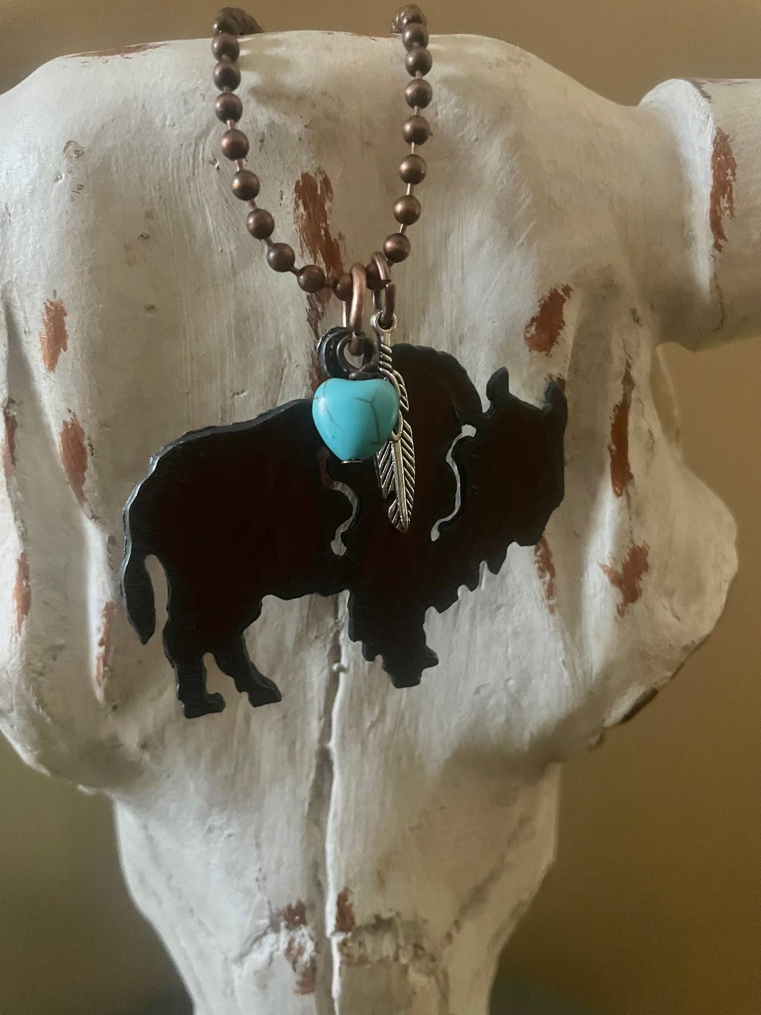 Rustic BUFFALO with feather charm and turquoise heart bead